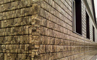 Металлический сайдинг под камень: достоинства, недостатки и руководство по монтажу