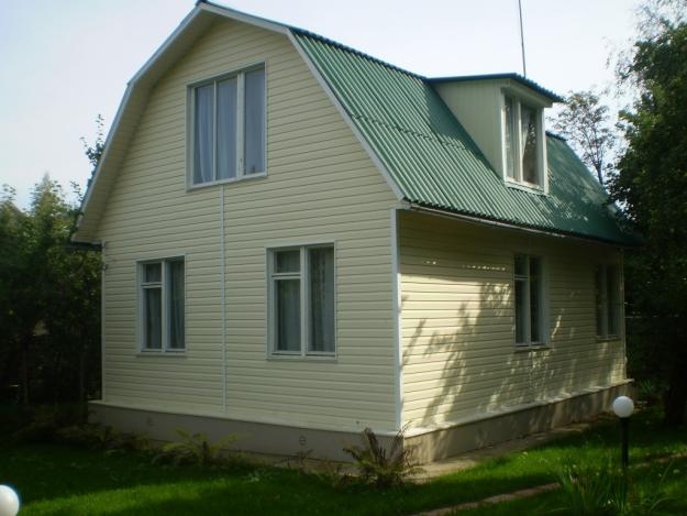 Дом, обшитый сайдингом с утеплителем