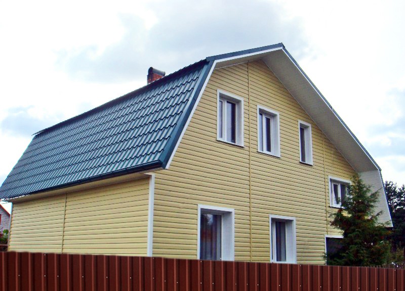 дом обшитый сайдингом текос